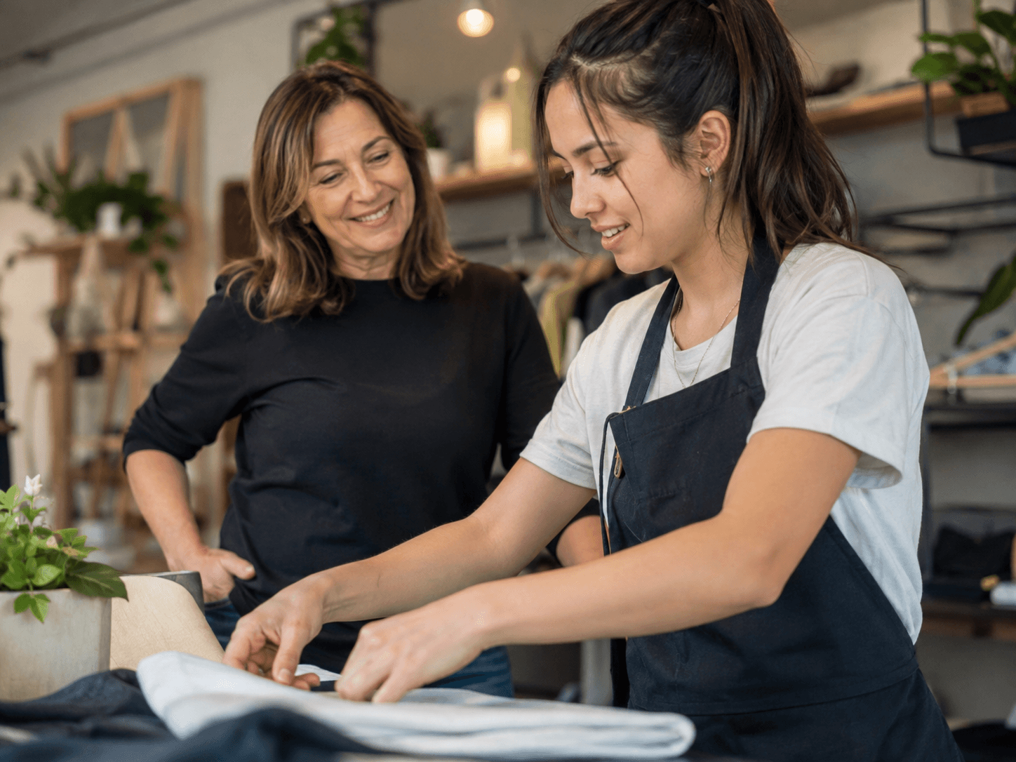 An experienced staff member training a newer team member